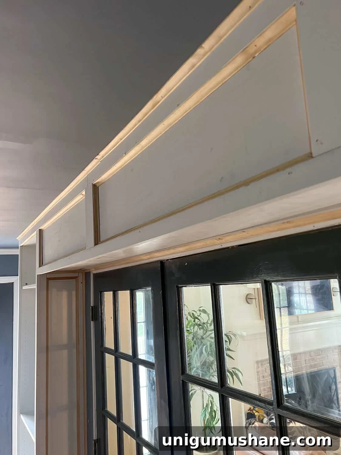 How to Build a Hidden Projector Screen with an IKEA Hack 12 built in box between bookcases to hide projector screen