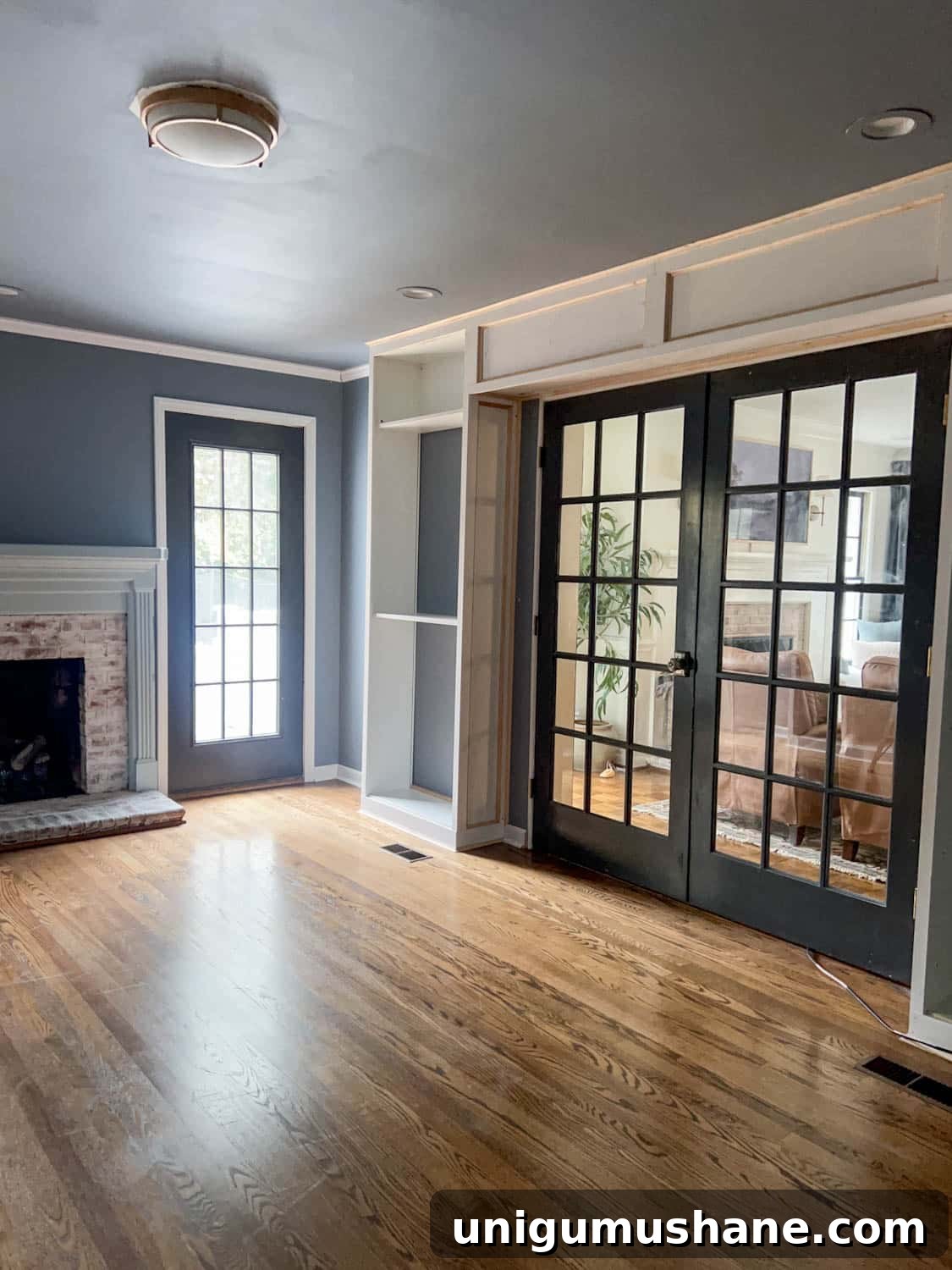How to Build a Hidden Projector Screen with an IKEA Hack 16 French doors with IKEA billy bookcases built in