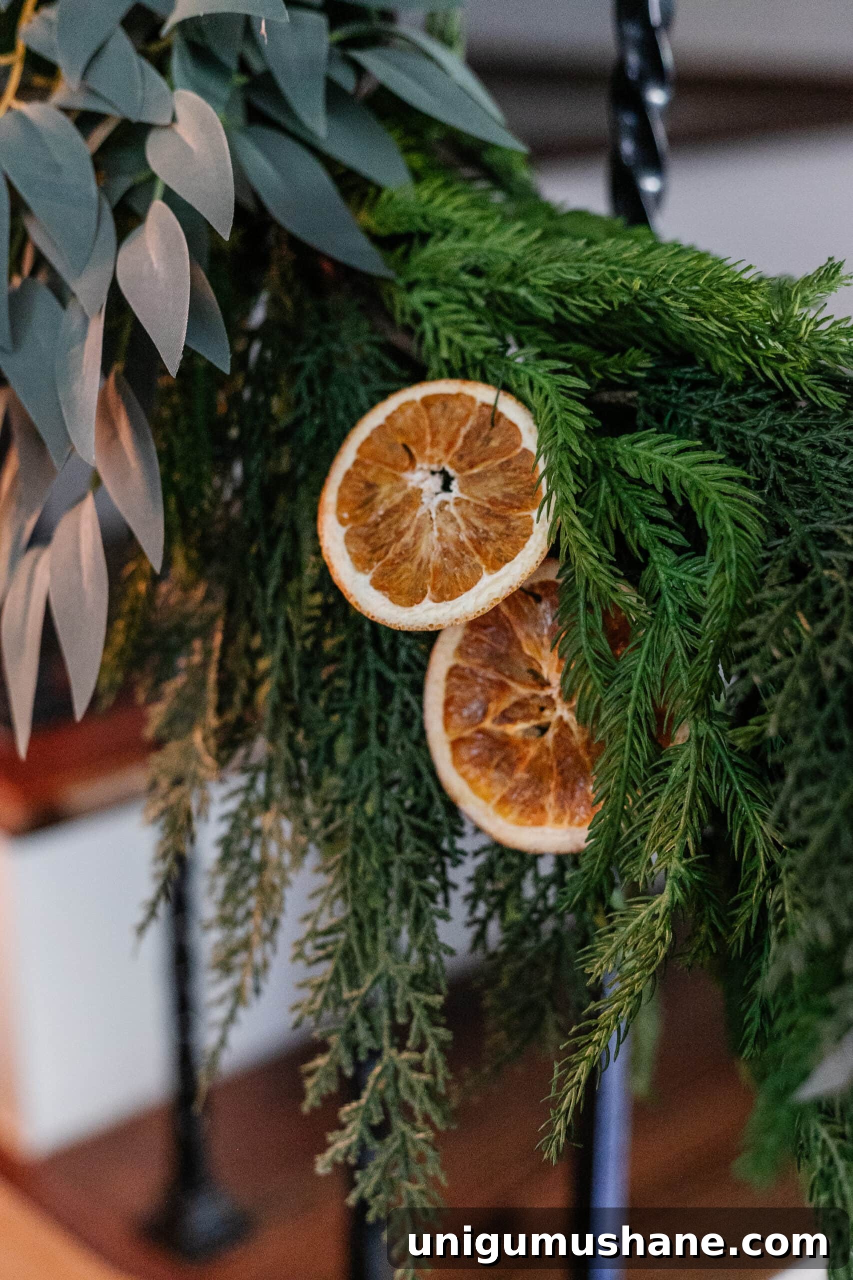 DIY Christmas Mantel Garland Ideas to Transform Your Fireplace 17 dried orange slices attached to pine garland with florist wire