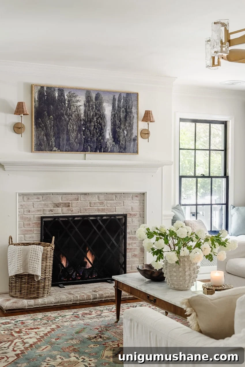 DIY bobbin frame on a Samsung frame TV + rattan sconces above a limewashed brick fireplace
