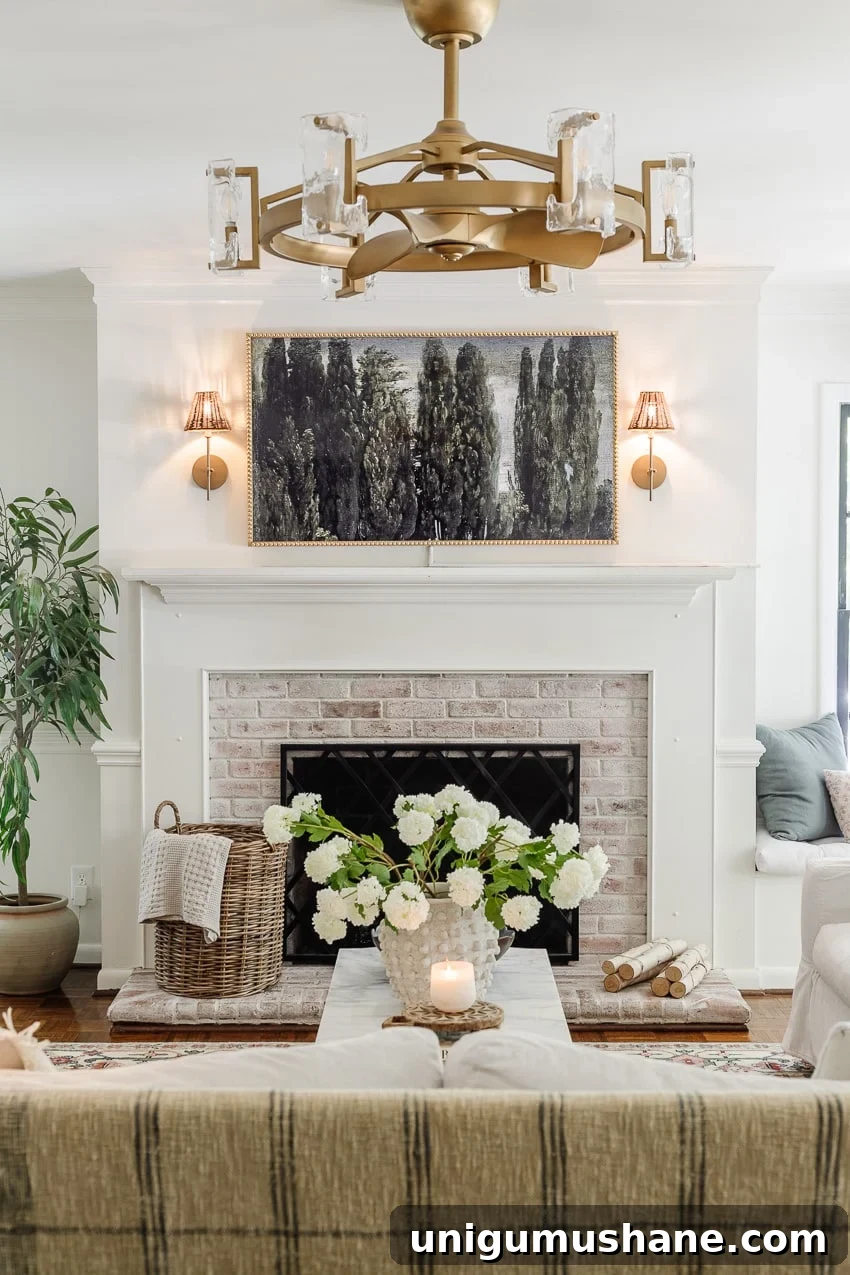 DIY bobbin frame on a Samsung frame TV + rattan sconces above a limewashed brick fireplace