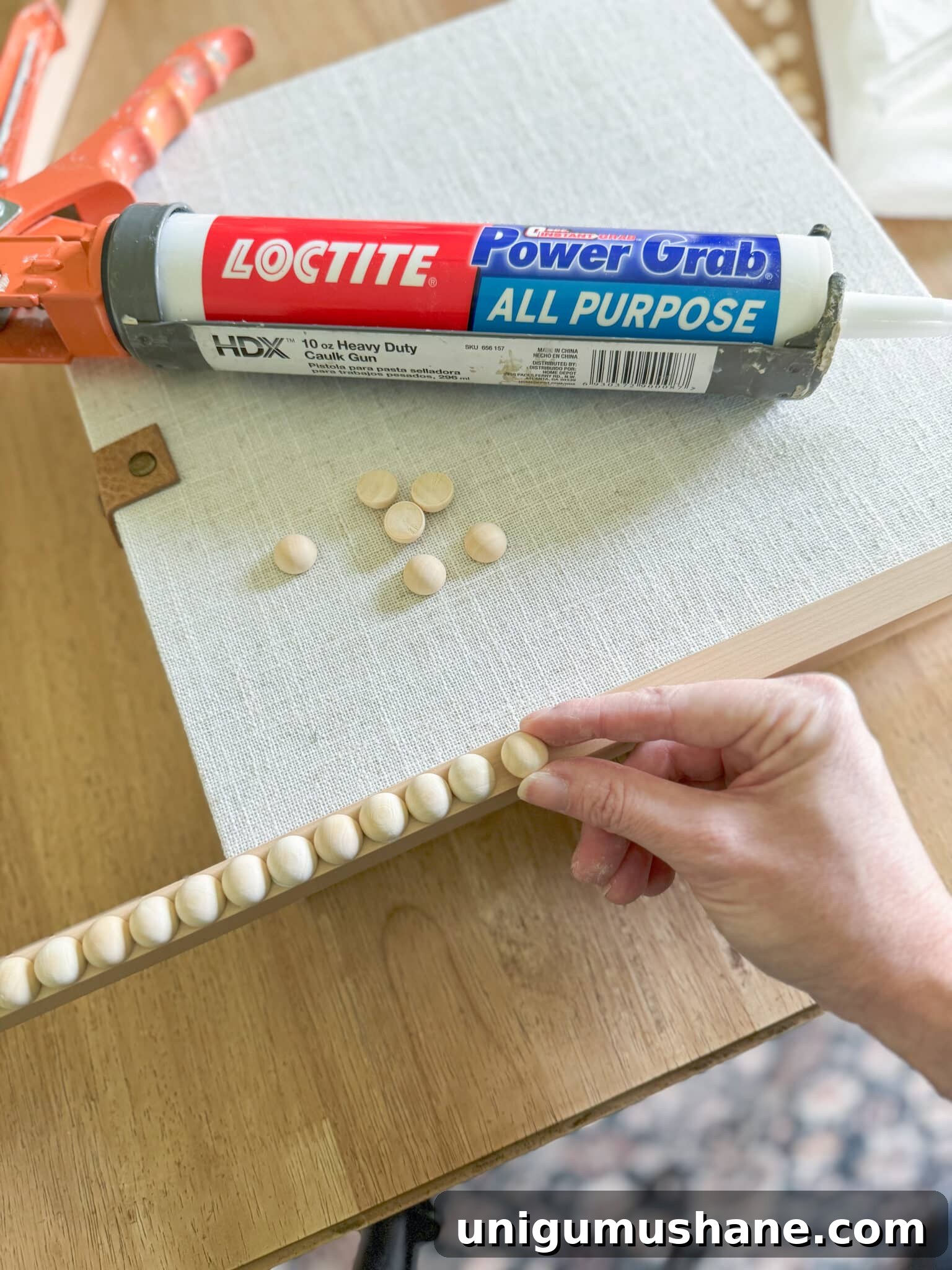 applying wooden split balls to a tv frame