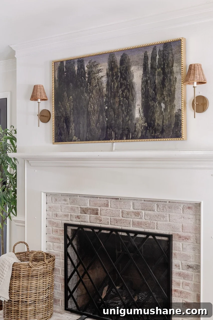 DIY bobbin frame on a Samsung frame TV + rattan sconces above a limewashed brick fireplace