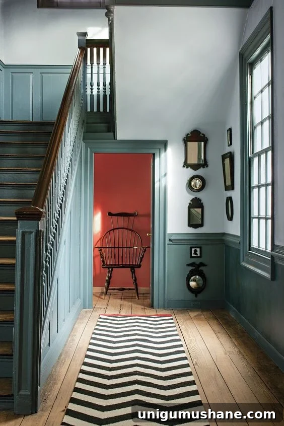 benjamin moore williamsburg wythe blue contrast trim in stairway and hallway