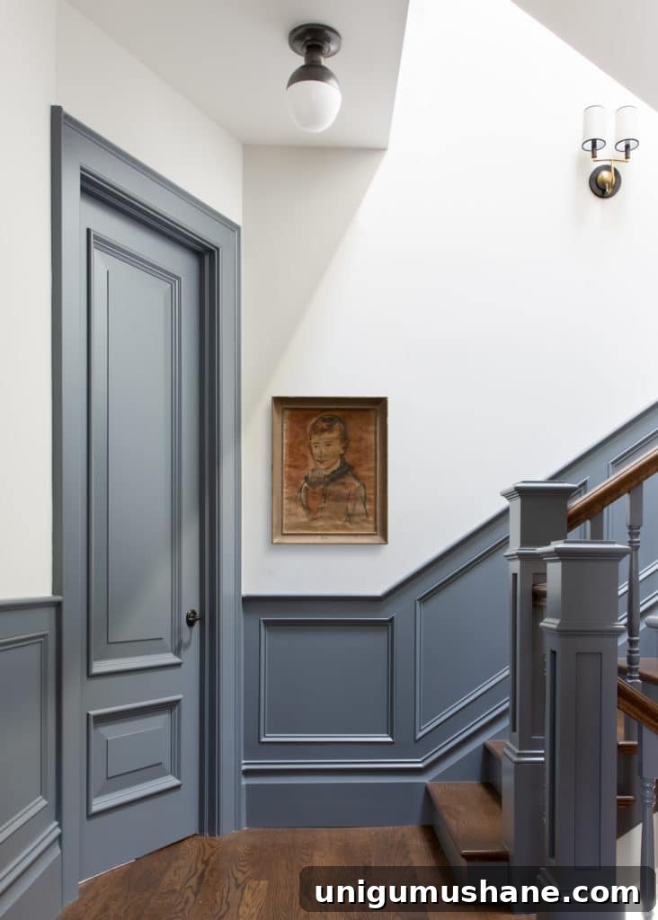 staircase with blue contrast trim and white walls