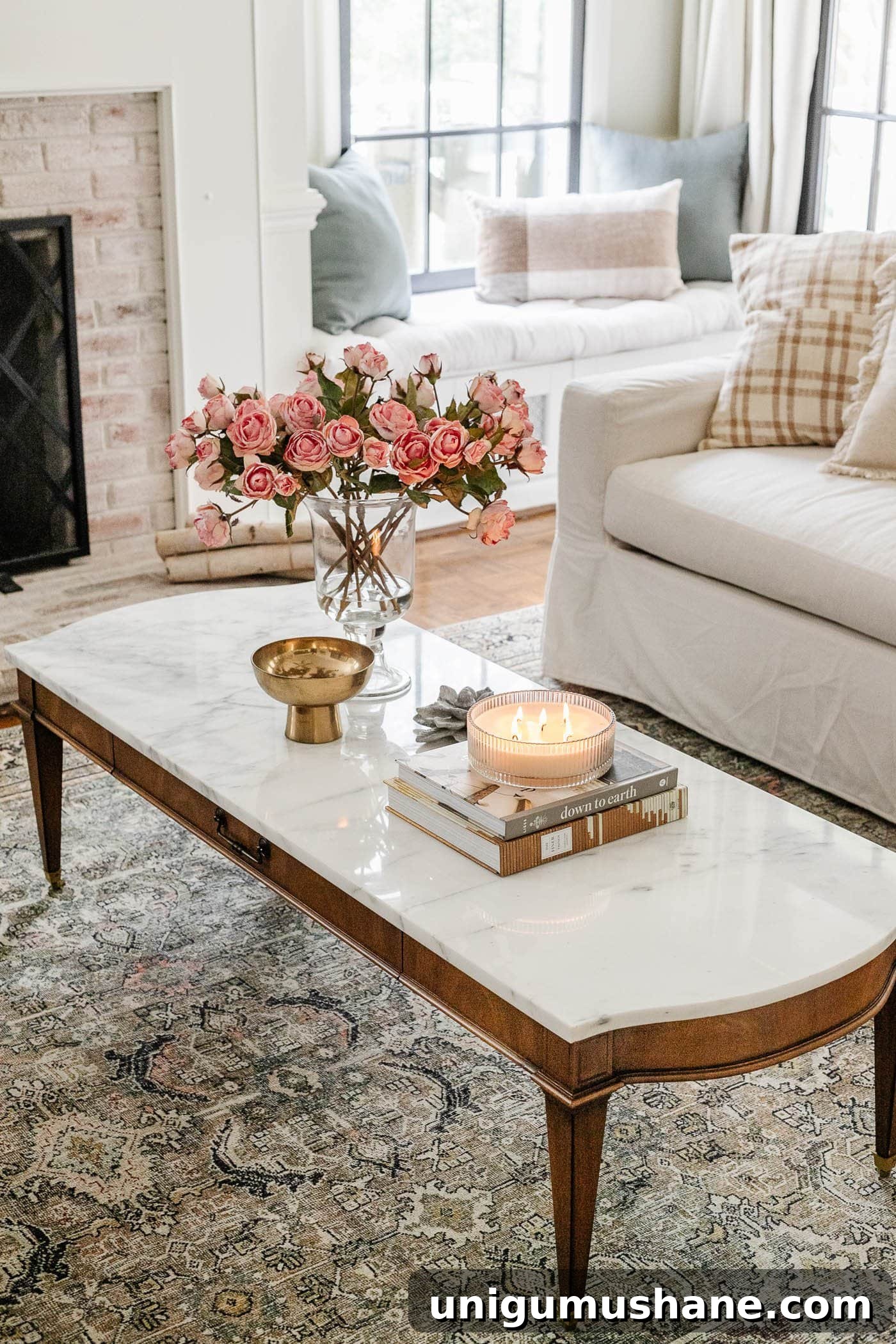 Where to Buy Antique Furniture and Vintage Home Decor Online 5 marble top coffee table with vase of roses, stack of books, and candle