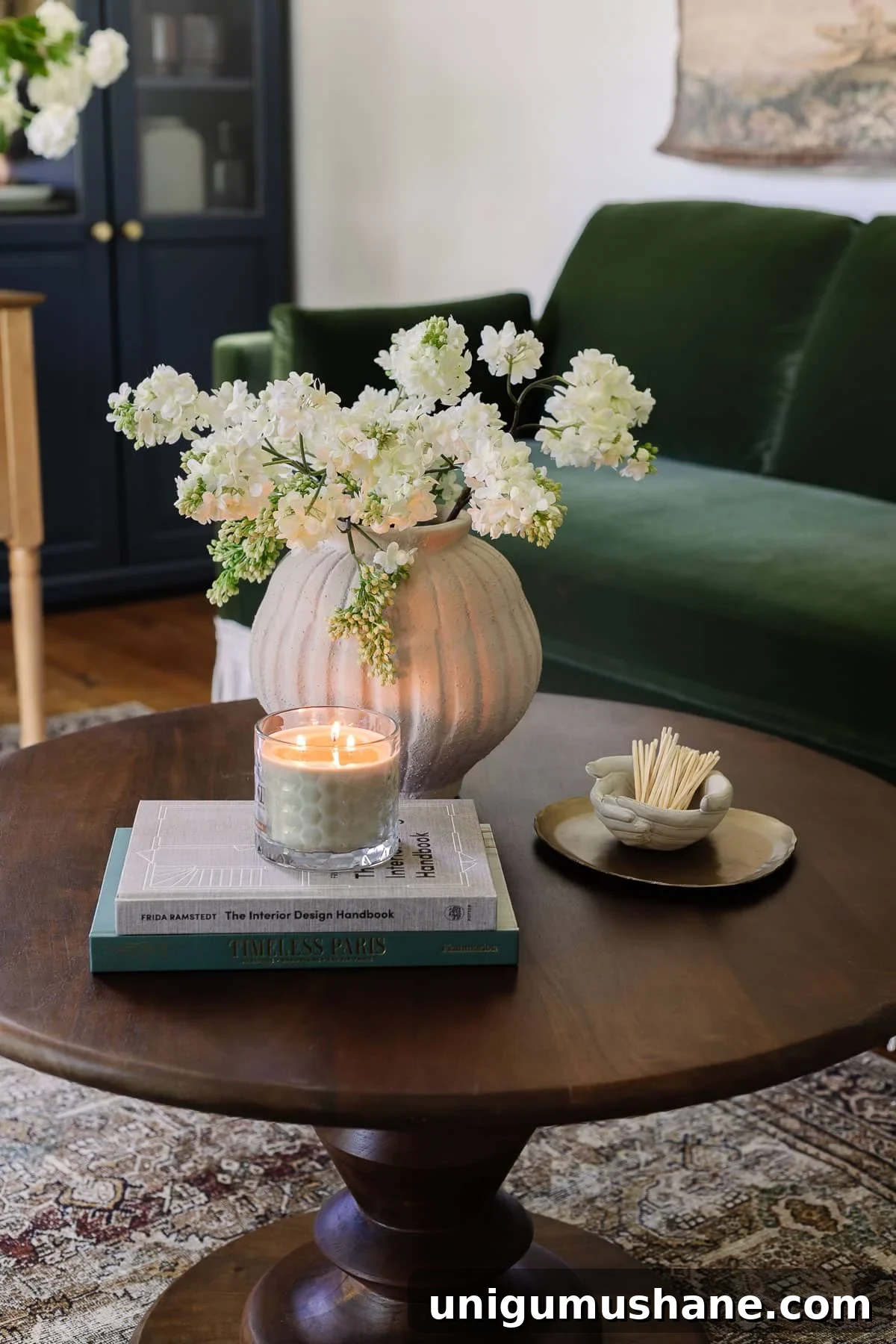 Home Office Layouts That Boost Productivity 10 coffee table decor with vase of flowers, coffee table books, candle, tray, and bowl of matches