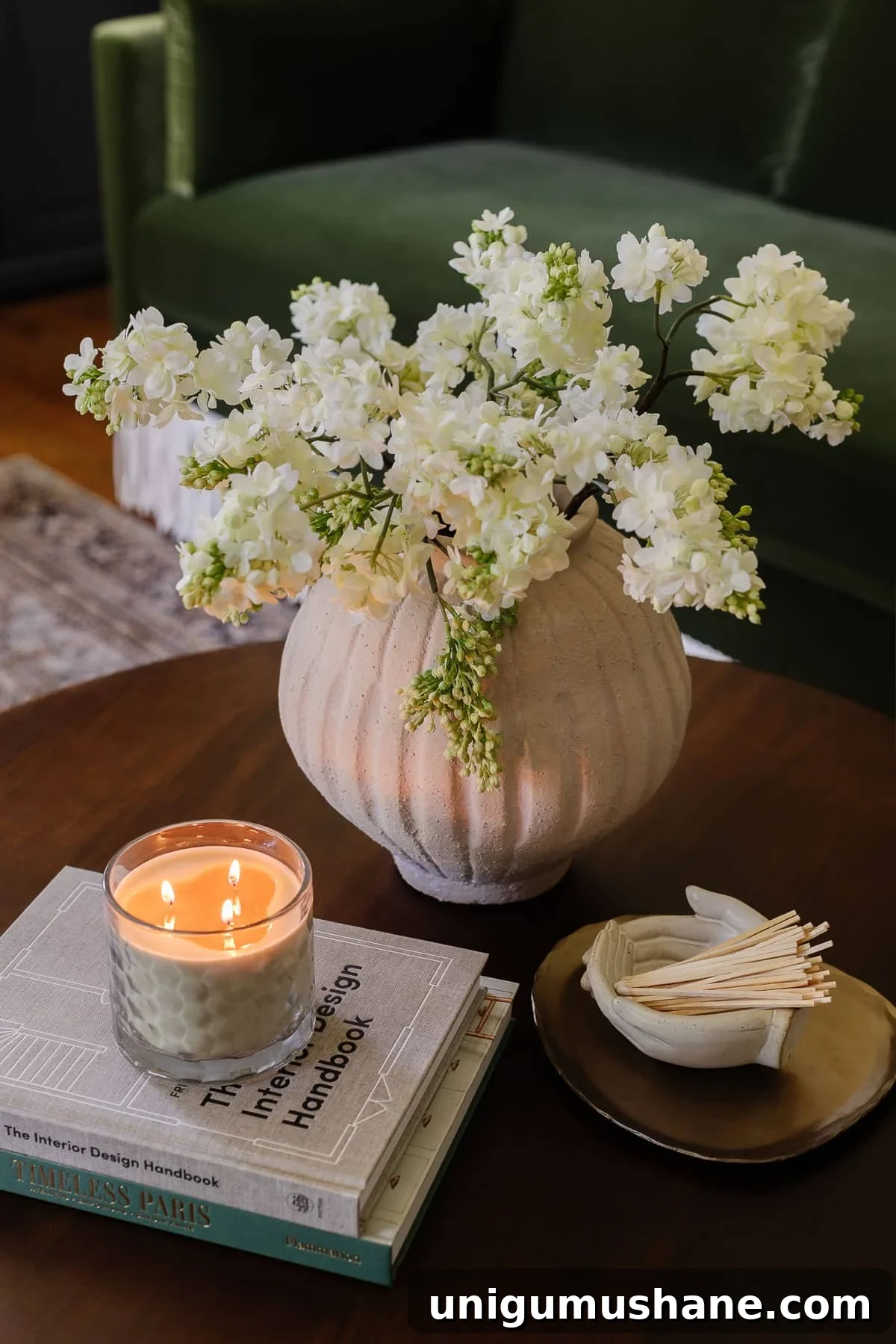 Home Office Layouts That Boost Productivity 11 coffee table decor with vase of flowers, coffee table books, candle, tray, and bowl of matches