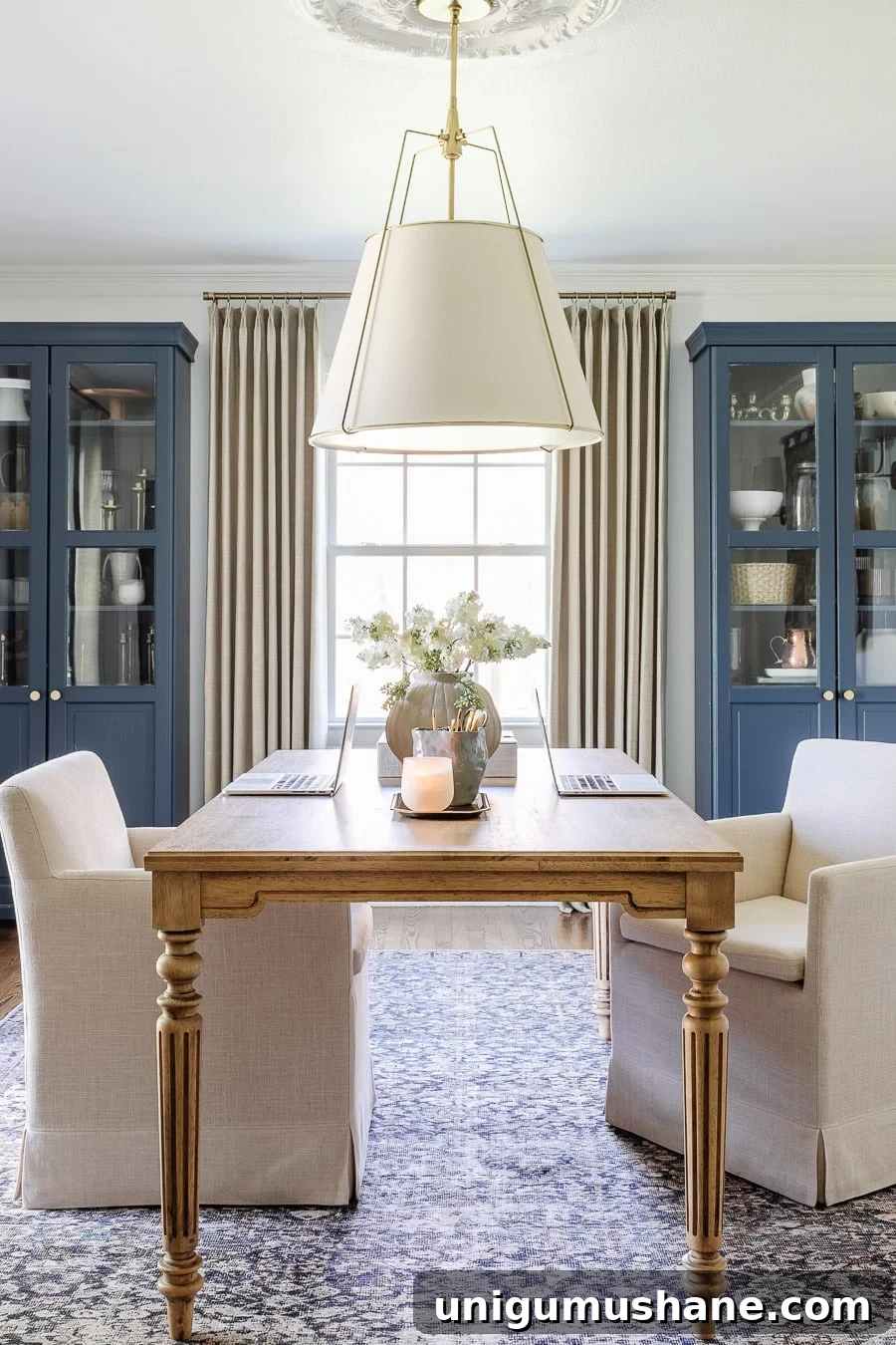Home Office Layouts That Boost Productivity 3 home office layout for 2 with work table and rolling chairs