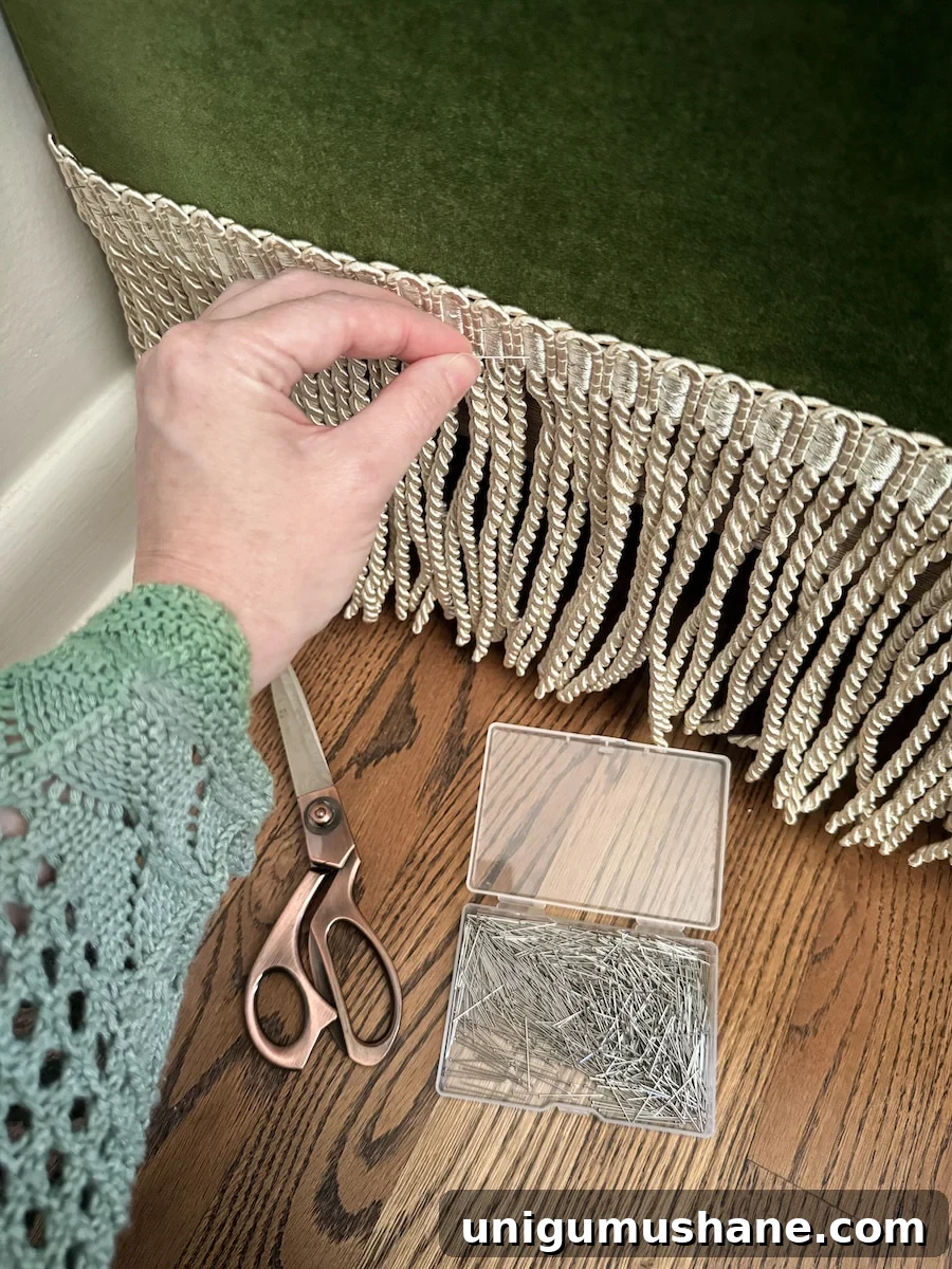 Transform Sofas and Chairs with DIY Fringe Trim 5 adding fringe trim to a sofa with straight pins