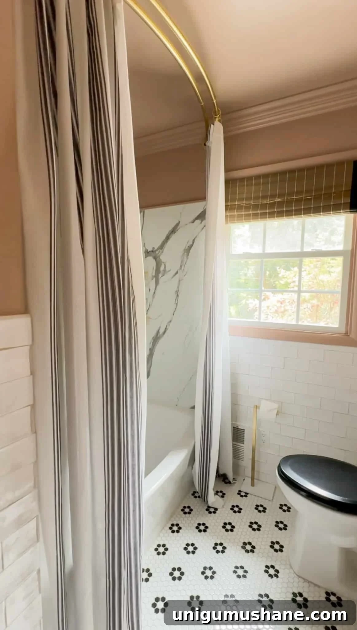 How to Hang an Extra-Long Shower Curtain Properly 3 double curtain panels as extra long shower curtain in a bathroom