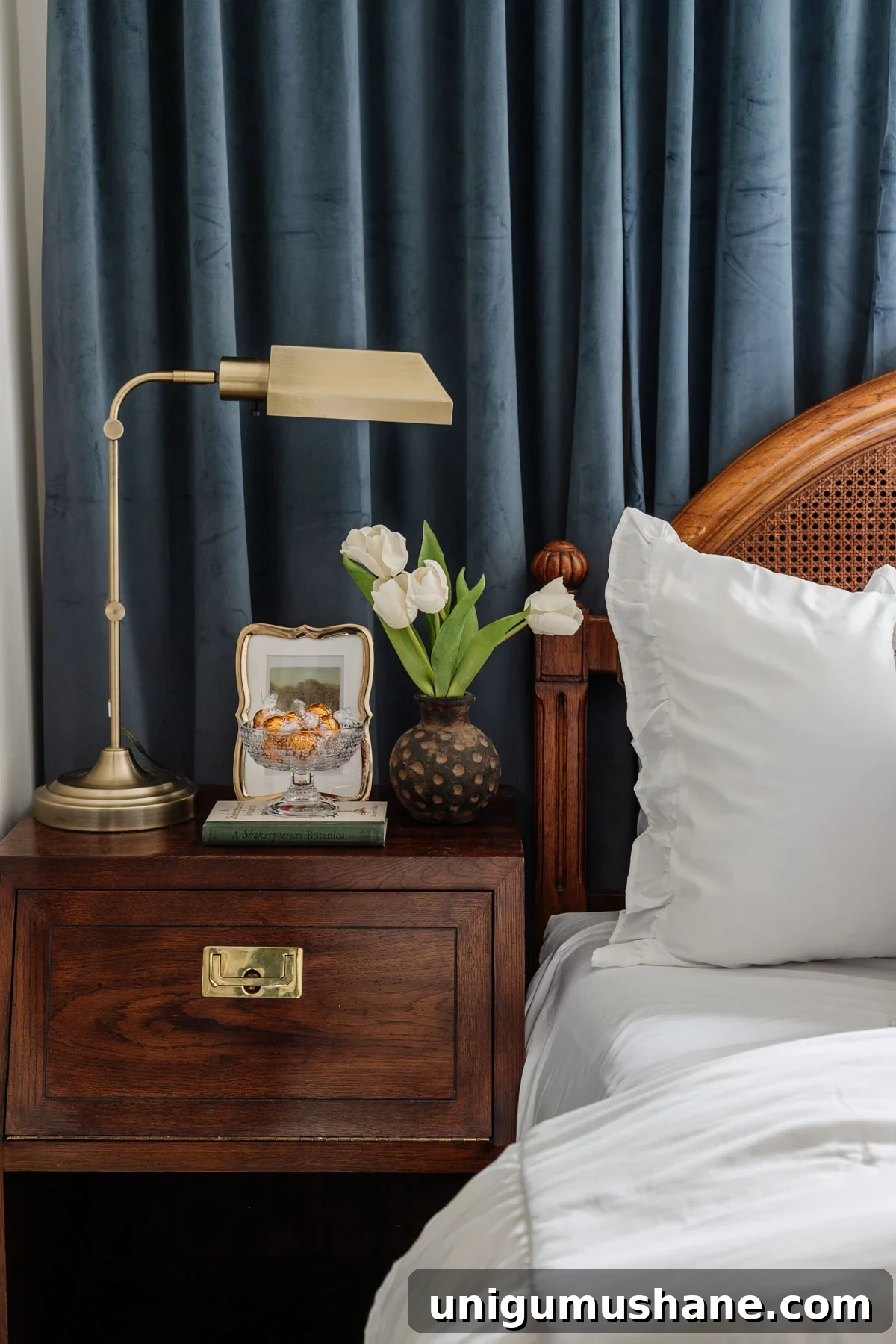 8 Reasons a Pedestal Bowl Belongs in Your Home Decor 9 glass footed bowl used as a candy dish on a guest bedroom nightstand