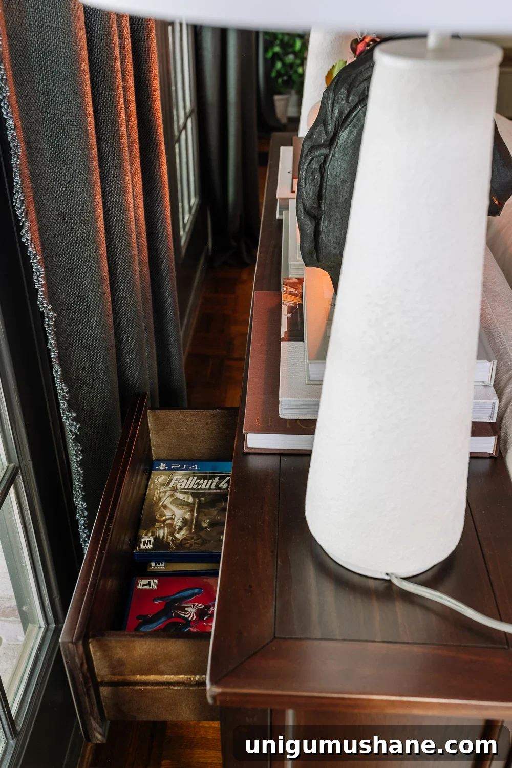 Avoid This Mistake When Placing a Sofa Table Behind Your Couch 4 playstation game storage in a living room console table