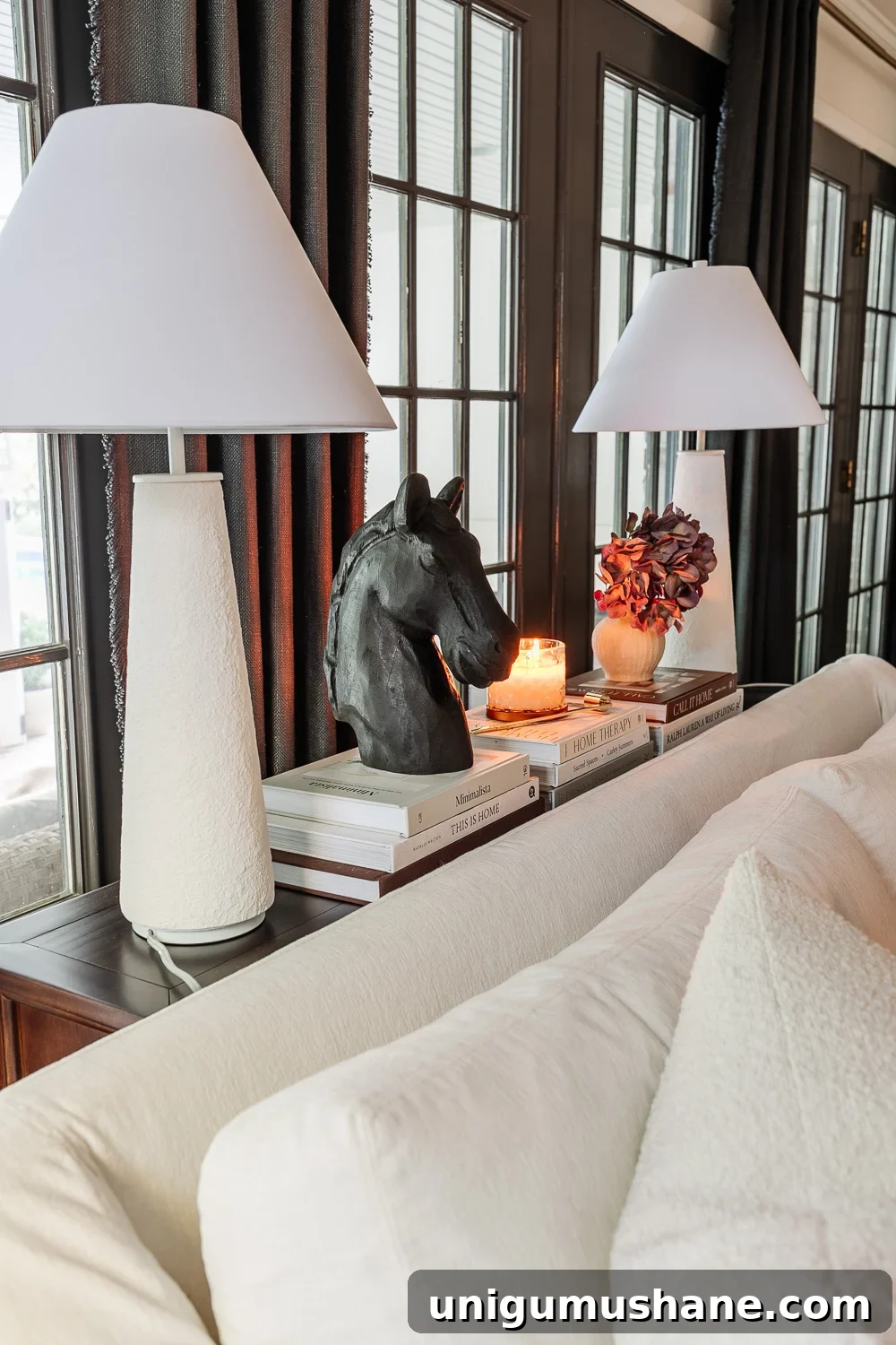 Avoid This Mistake When Placing a Sofa Table Behind Your Couch 6 sofa table decor ideas behind a sofa using lamps, books, and candles