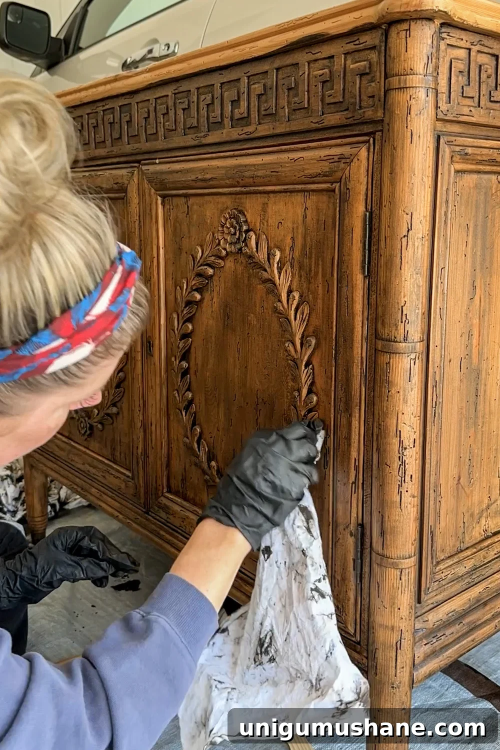 wiping away excess gel stain after first coat