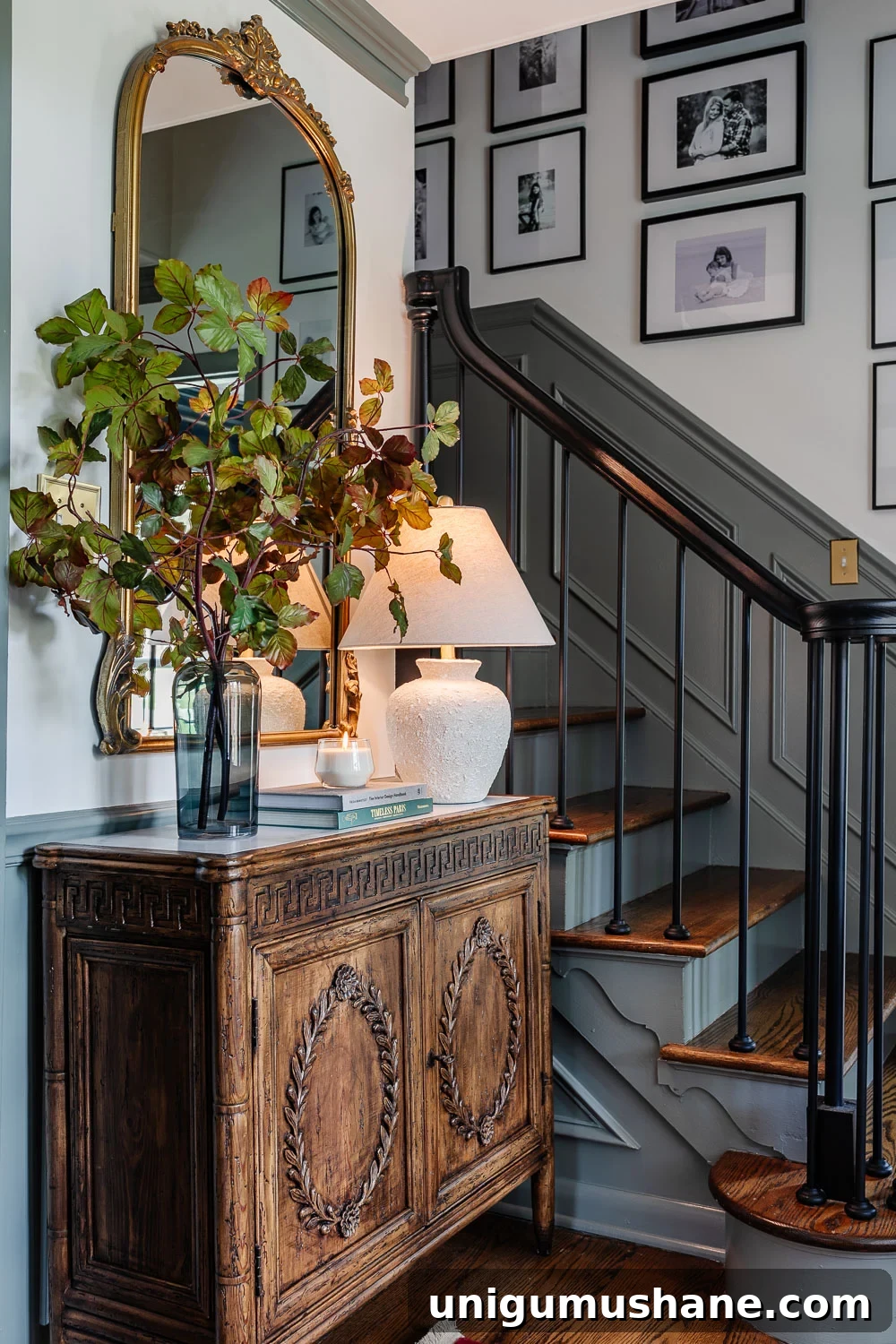 Stylish Entryway and Foyer Makeover Ideas Under $300 7 foyer decorating ideas with credenza styled with lamp, vase of stems, books, and candle