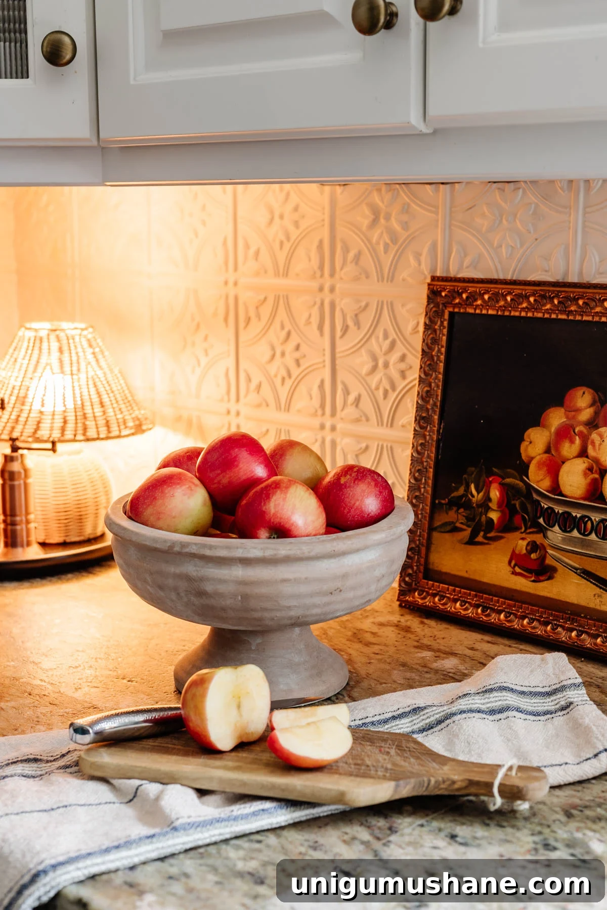 14 Natural Home Decor Ideas to Bring the Outdoors In 8 footed bowl used as fruit bowl on kitchen countertop