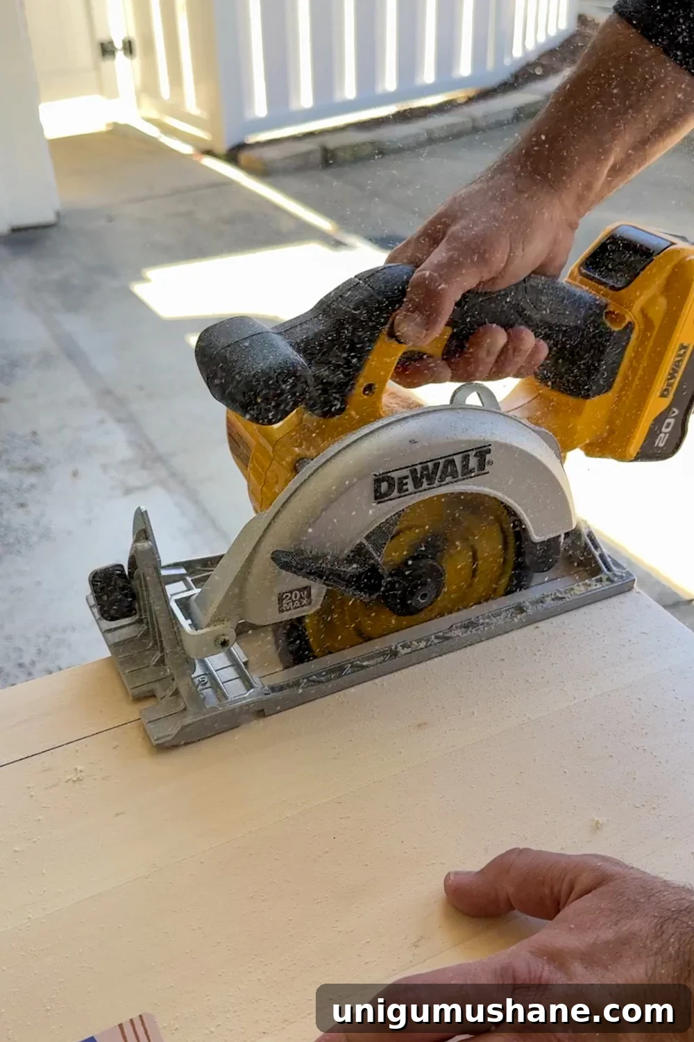 cutting plywood piece for fireplace trim with circular saw