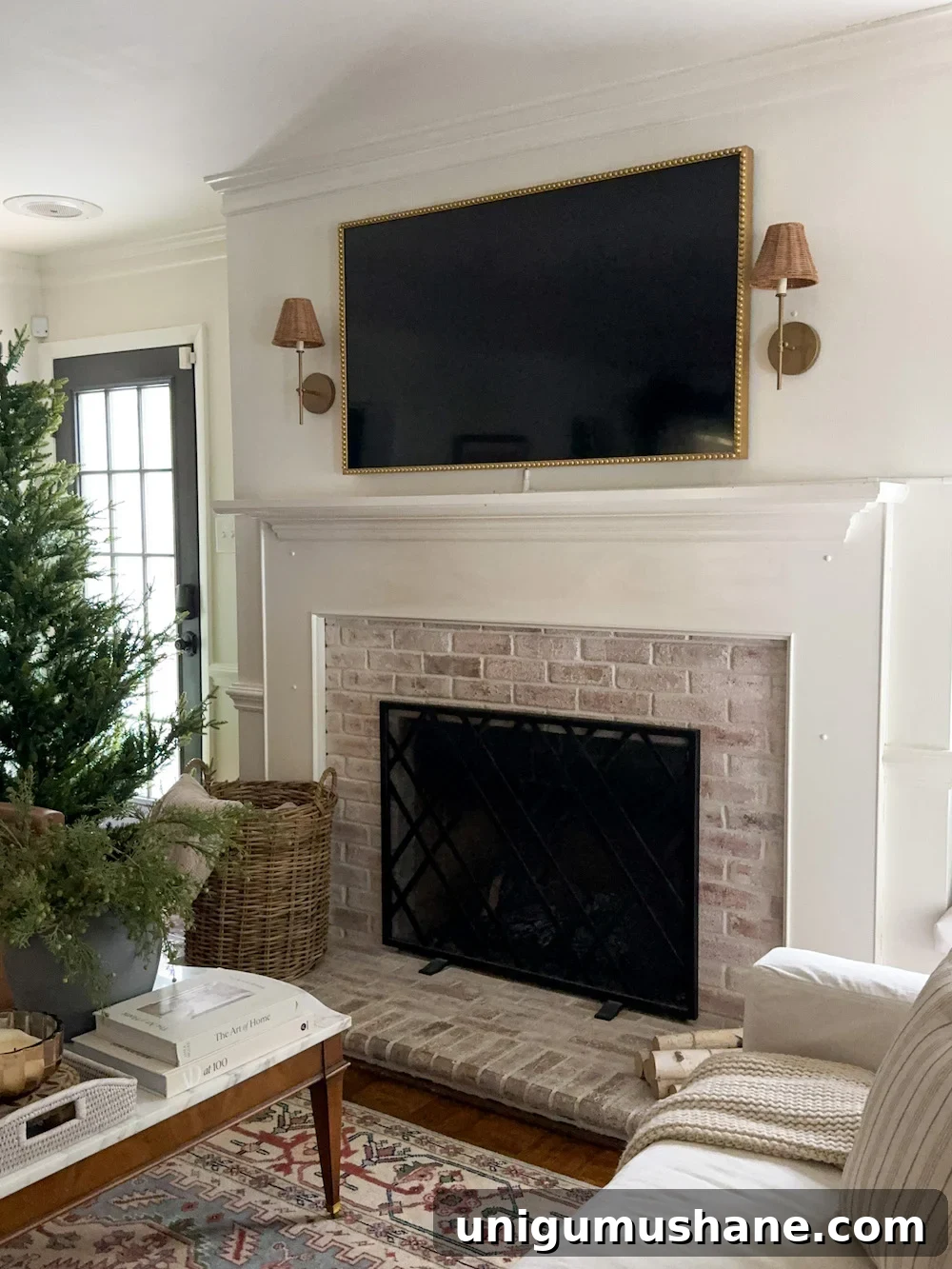 plain mantel with limewashed brick fireplace