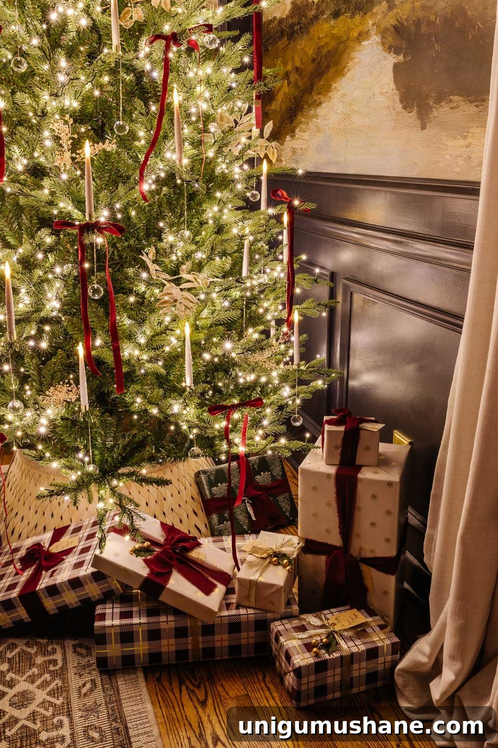 gifts under a Christmas tree at night in candlelight