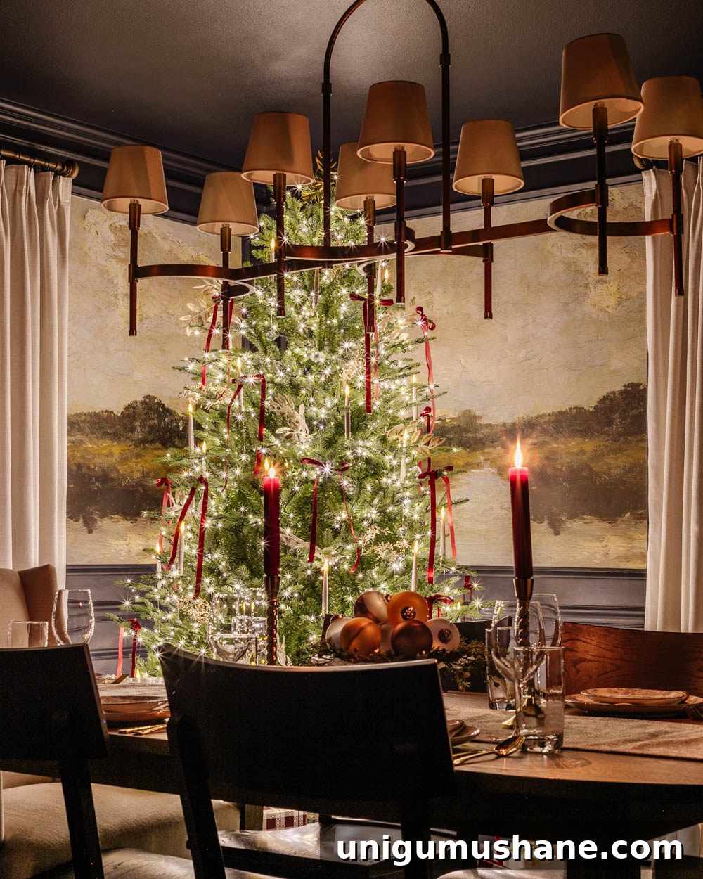 candlelight Christmas dining room table with centerpiece and tree