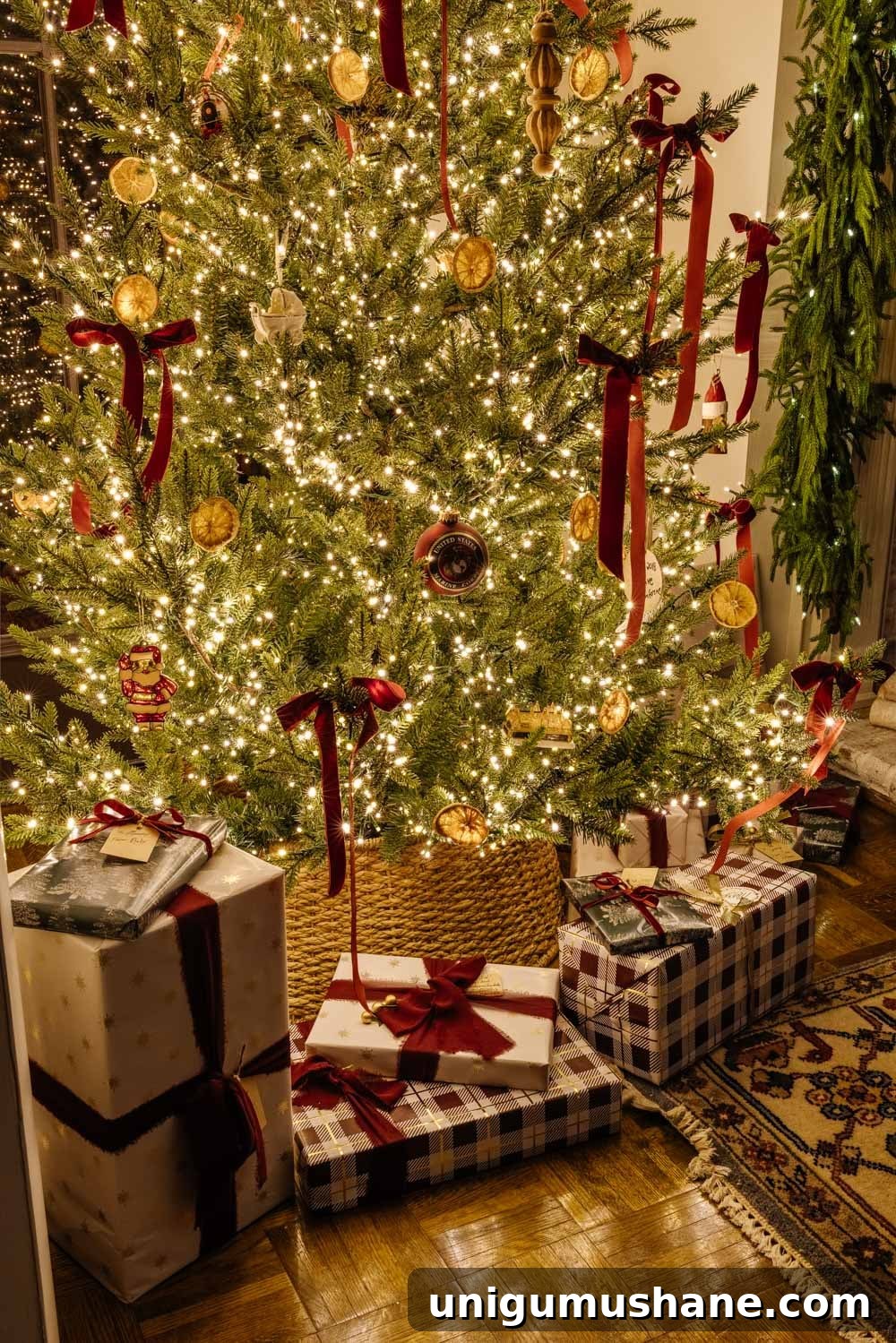 candlelight Christmas tree with gifts