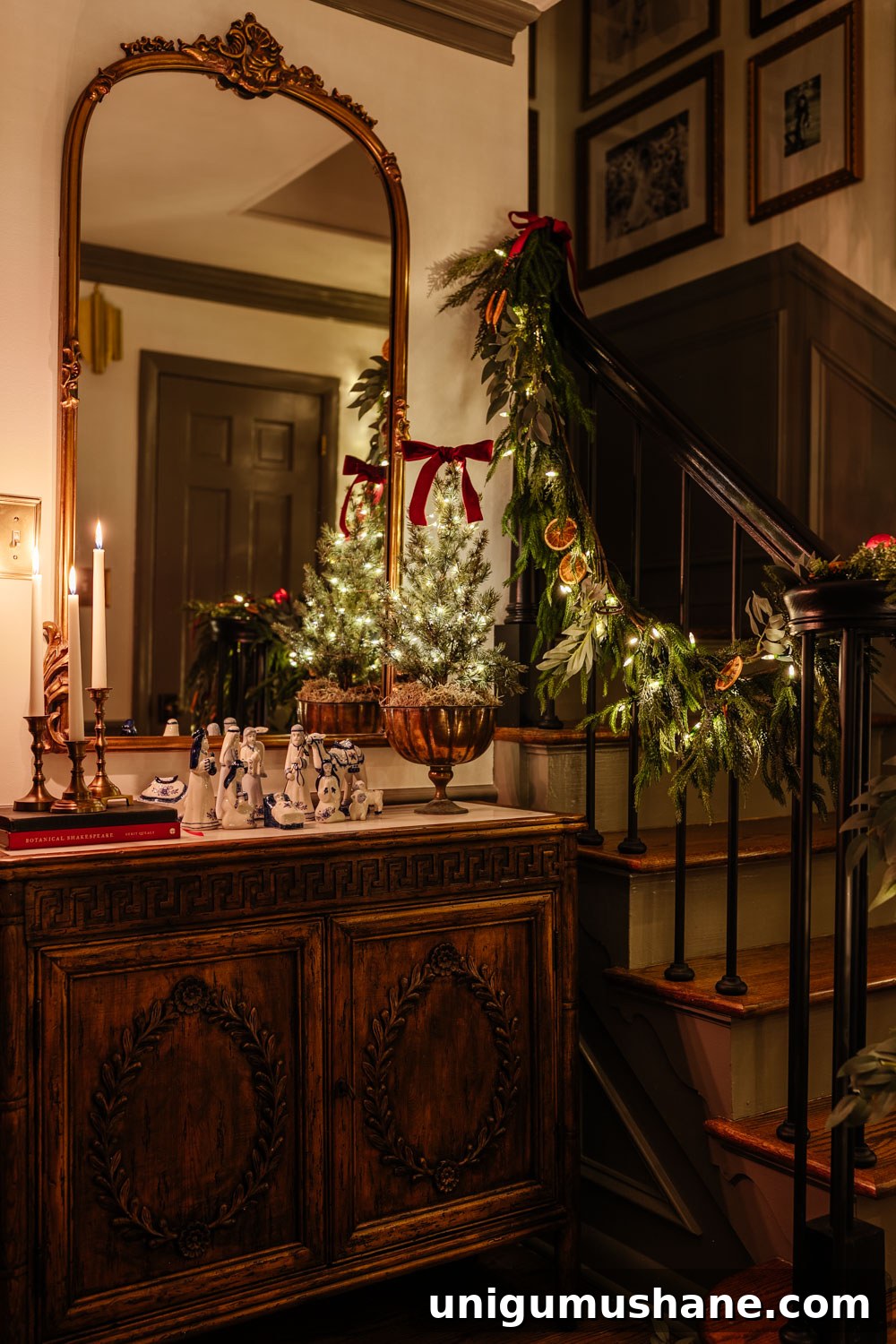 traditional candlelight Christmas night tour in entryway with nativity