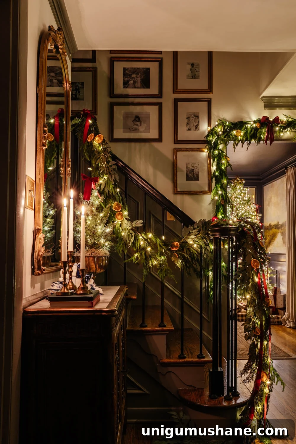 traditional candlelight Christmas night tour in entryway with nativity