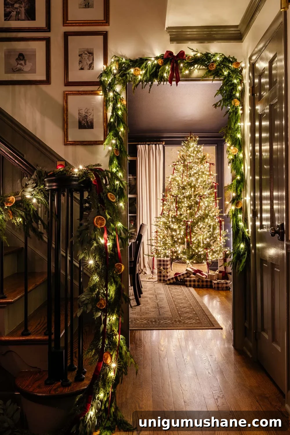 candlelight Christmas tour doorway with garland around tree