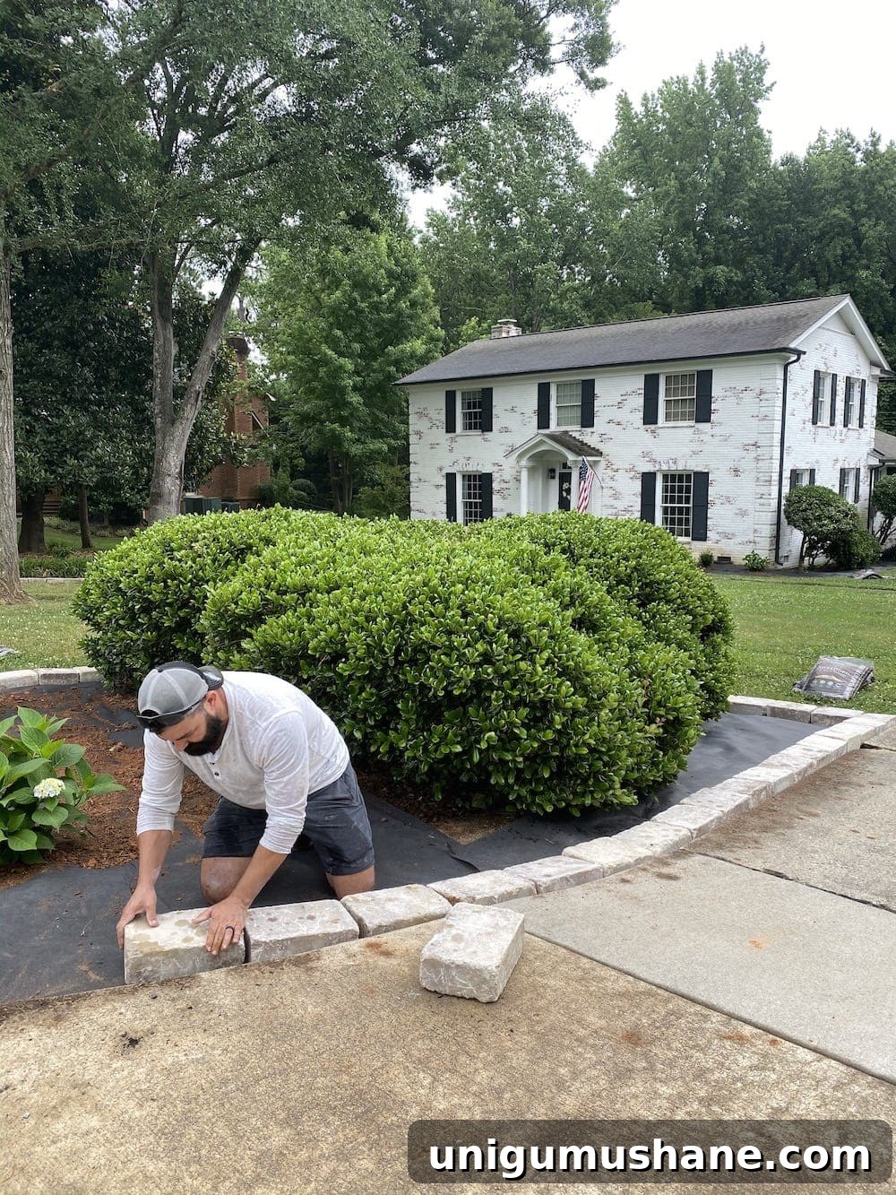 16 DIY Curb Appeal Ideas to Transform Your Front Yard 13 stone edgers around a flower bed