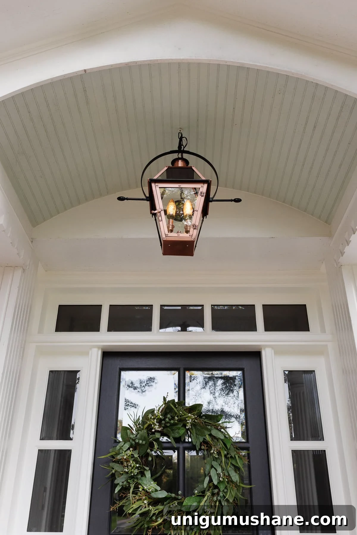 16 DIY Curb Appeal Ideas to Transform Your Front Yard 26 copper lantern fixture on a porch