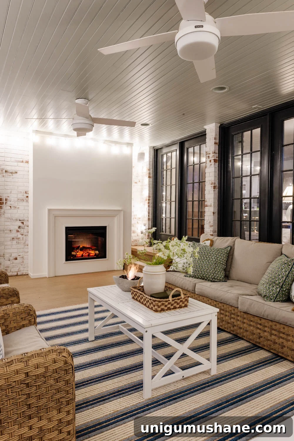 How We Turned Our Backyard into a DIY Outdoor Living Room 17 outdoor living room with fireplace on a back porch
