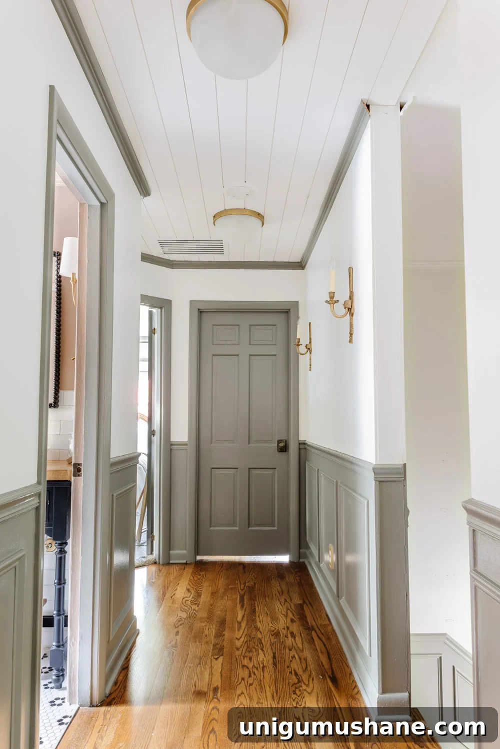 How to Fix a Sticking Painted Door Without Stripping Paint 2 painted doors and wainscoting in a hallway with Sherwin Williams Willowleaf