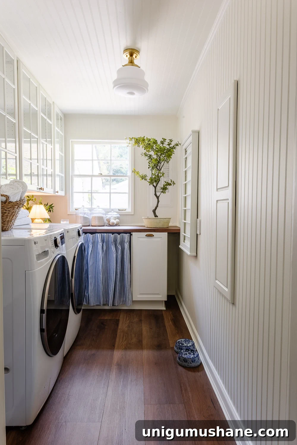 narrow laundry room layout with IKEA cabinets with vintage Nancy Meyers style