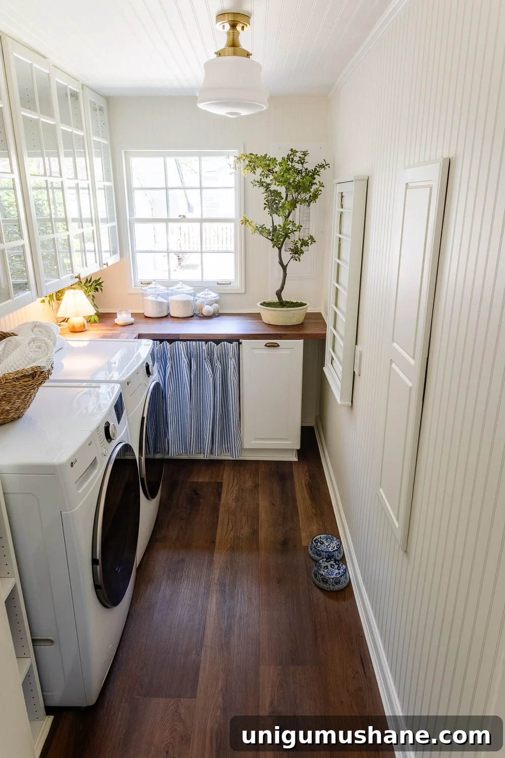 Narrow Laundry Room Layout That Maximizes Storage and Efficiency 8 narrow laundry room layout with IKEA cabinets with vintage Nancy Meyers style