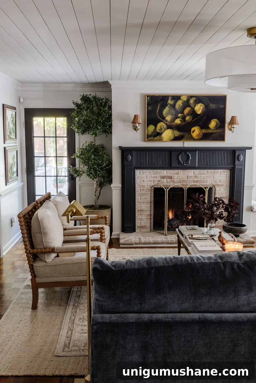 8 Years of Living Room Renovation and Design 12 living room with blue fireplace mantel, marble coffee table, and modern fandelier