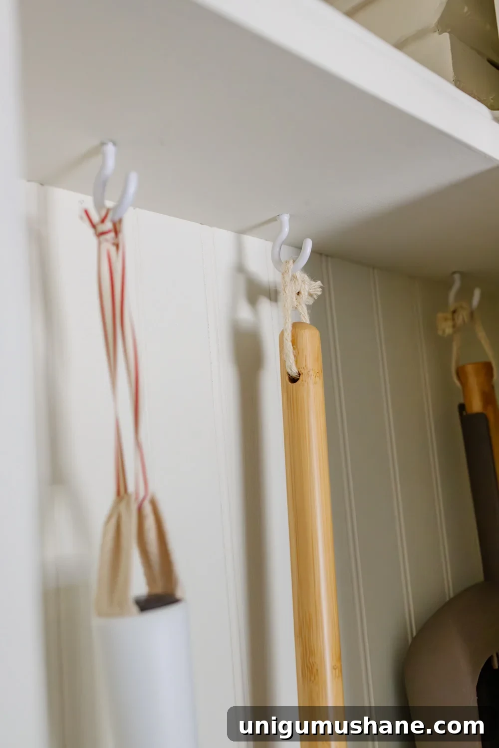 DIY Hidden Broom Closet That Disappears Into the Wall 13 hidden diy broom cupboard and cleaning supply storage in a laundry room