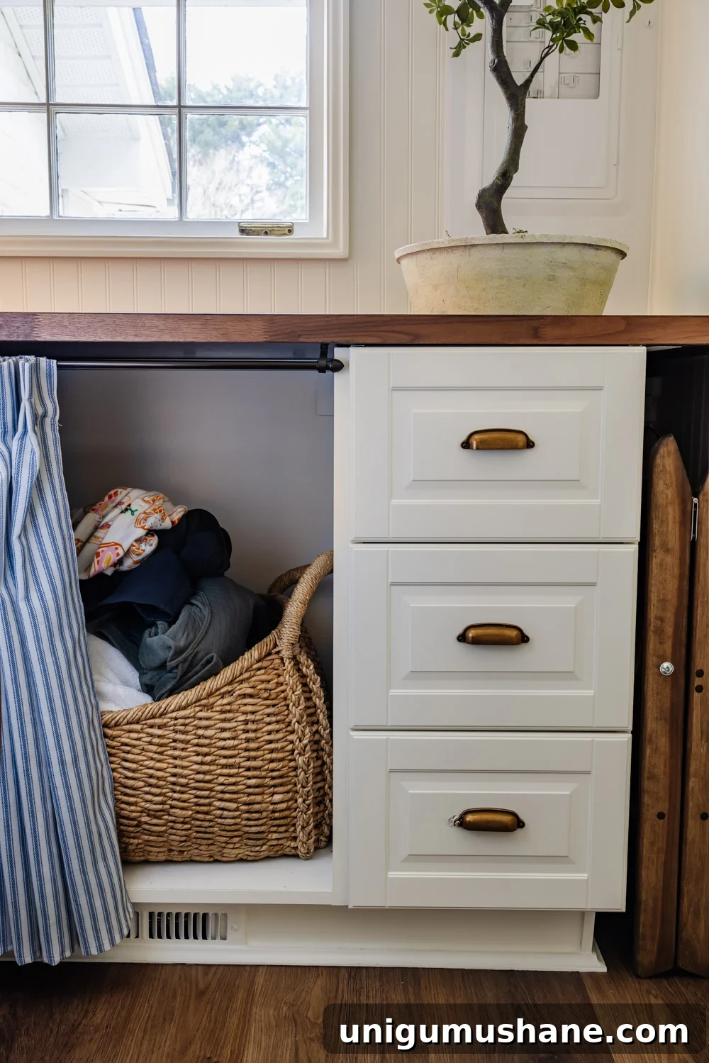 Maximize Storage in a Small Laundry Room 9 small laundry room organization - hamper basket covered by under countertop skirt