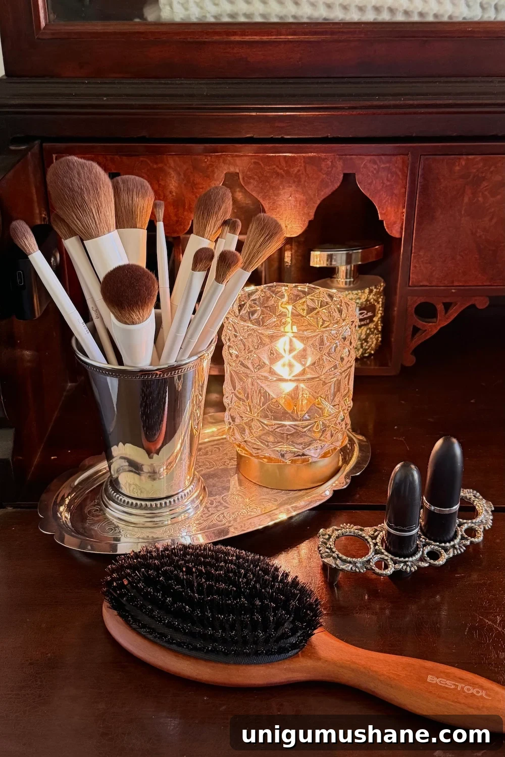 Turn a Secretary Desk Into a Makeup Vanity for Small Bathrooms 7 towels and jars stored in cabinet