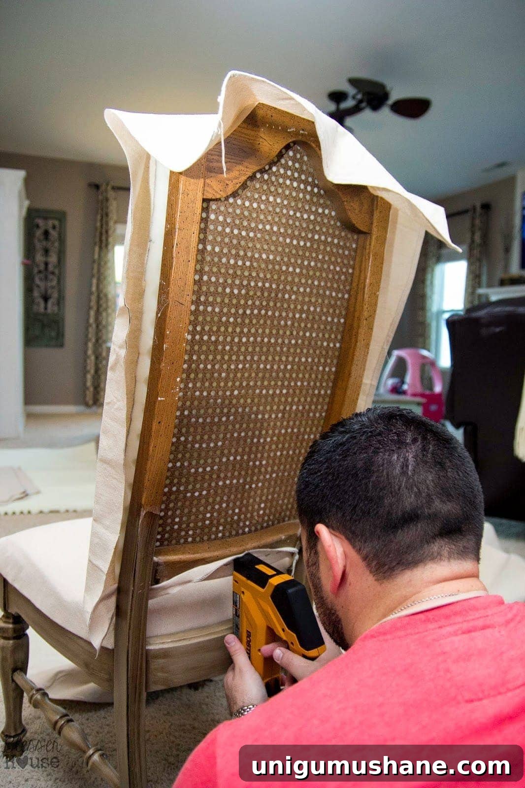 DIY No-Sew Knockoff Dining Chairs 10 Stapling drop cloth fabric to chairback