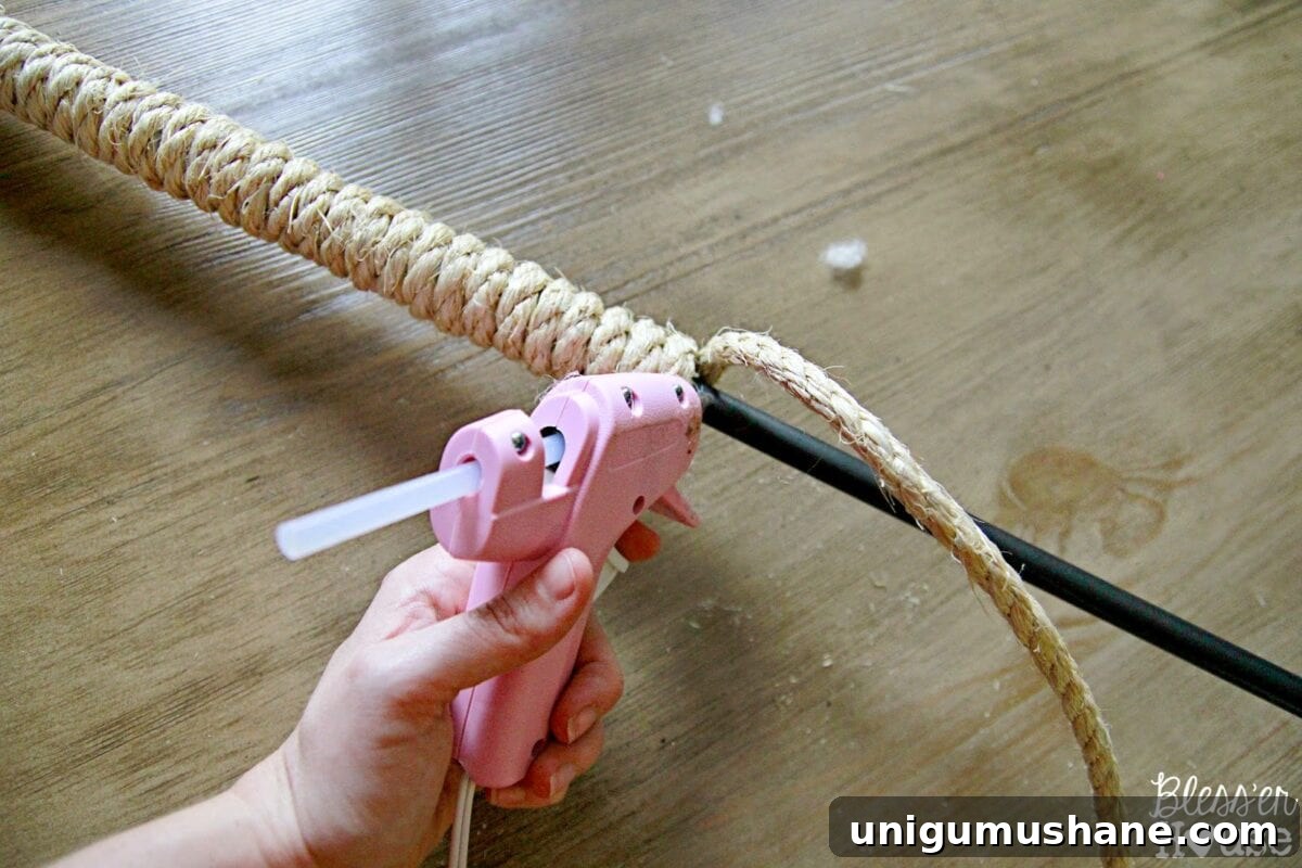 Close-up of sisal rope wrapped around pendant light rod