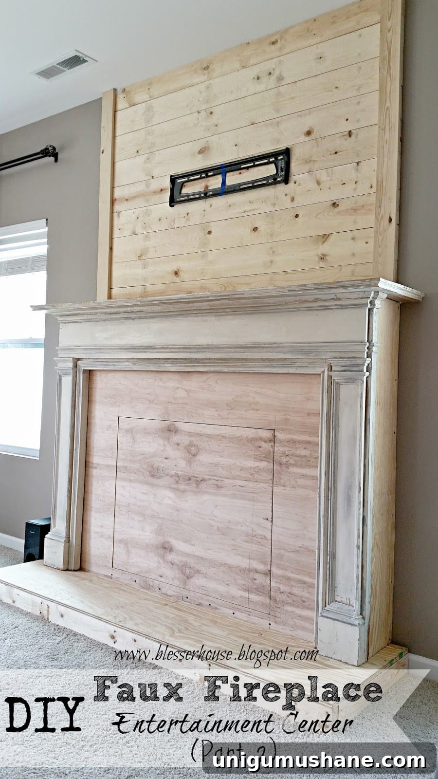 How to Build a Faux Fireplace Entertainment Center: Part 2 2 plank wall over faux fireplace
