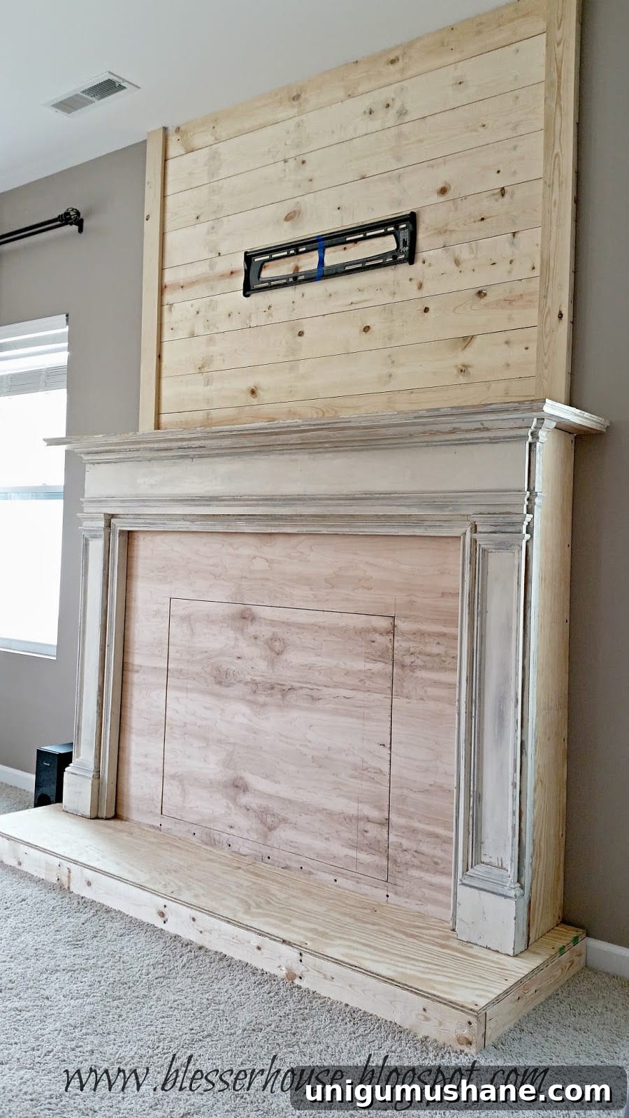 How to Build a Faux Fireplace Entertainment Center: Part 2 12 plank wall ready for paint