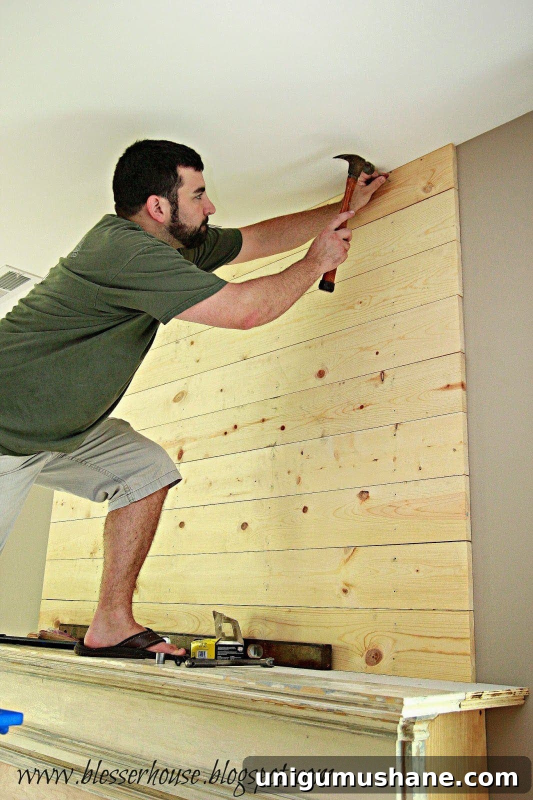 How to Build a Faux Fireplace Entertainment Center: Part 2 8 final plank trimmed to fit