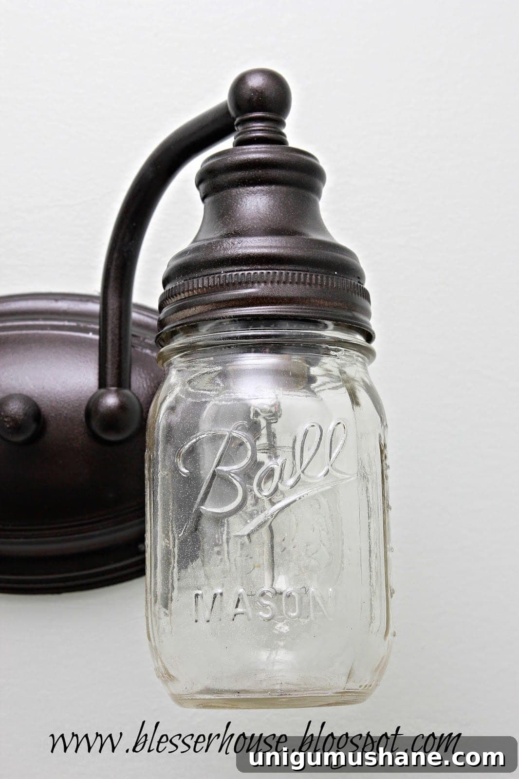 DIY Mason Jar Vanity Light for Rustic Bathroom Lighting 10 Completed mason jar farmhouse vanity light with Edison bulb