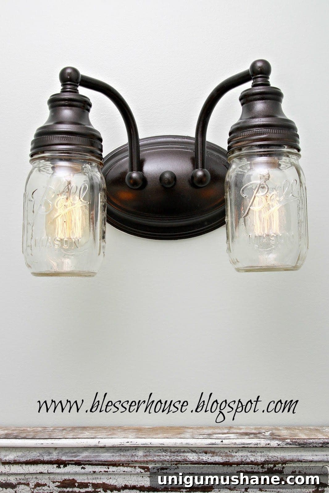 DIY Mason Jar Vanity Light for Rustic Bathroom Lighting 11 Farmhouse mason jar light above mirror