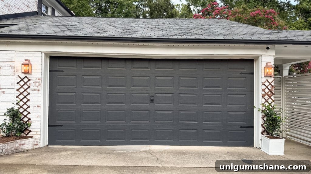 garage curb appeal with copper lanterns, star jasmine, and outdoor trash can hiding panels